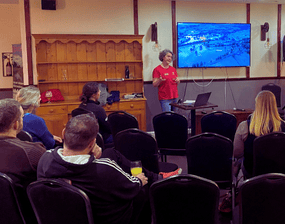 Ousewem’s Natural Flood Management Programme Manager, Amanda Crossfield presenting at our pie and peas night, 10 March 2025