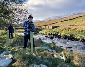 Delivery team member, Patrick, planting trees as part of our natural flood management (NFM) delivery