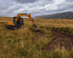 an image of a digger used in delivering Ousewem’s second pilot project in Upper Wensleydale including 15 scrapes