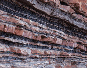 a photo showing and exposed rock face and the layers present in rock