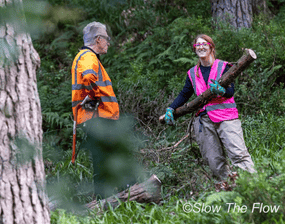 Two Slow the Flow volunteers at work at Hebden Bridge